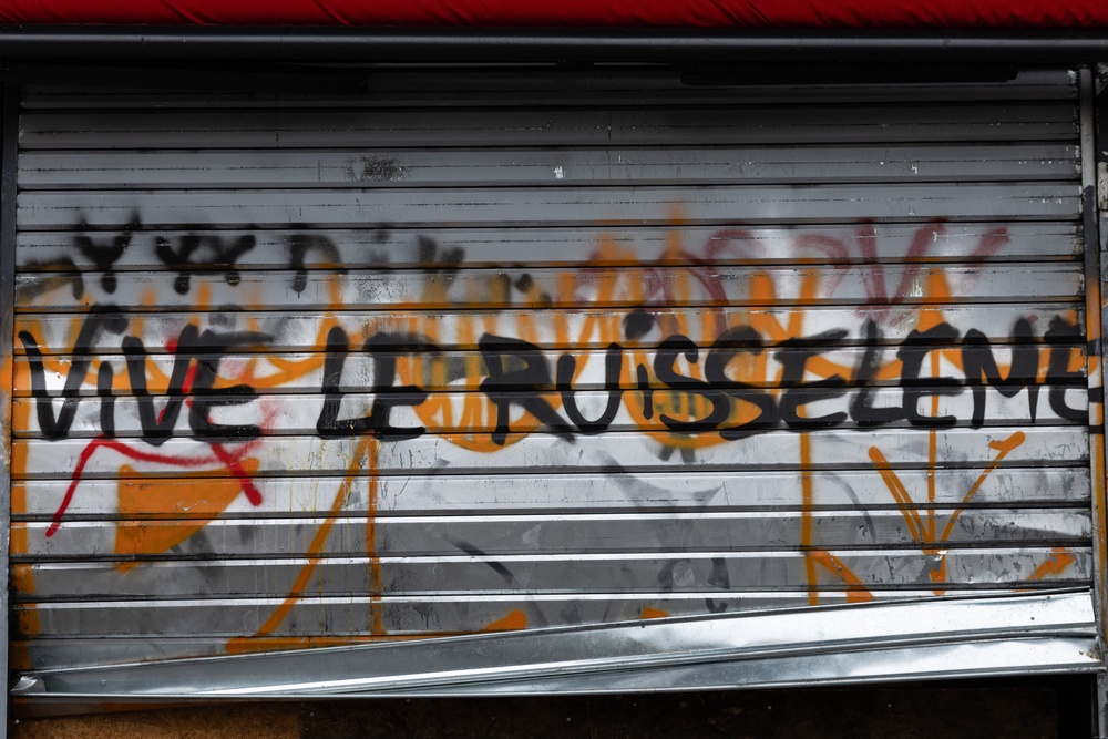 A shop shutter with the words 
