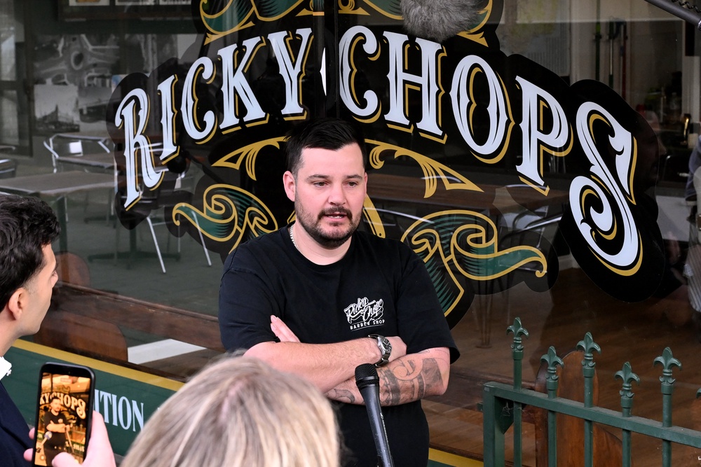 Barber Ricky Jefferies speaks to the media a day after tackling a man accused of attacking Australian politician Helen Haines (AFP/Getty)