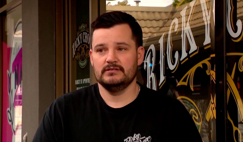 Australian barber Ricky Jefferies, who ran out of his store to detain a man who authorities allege deliberately drove a car into Australian lawmaker Helen Haines, speaks in Wangaratta (Reuters)