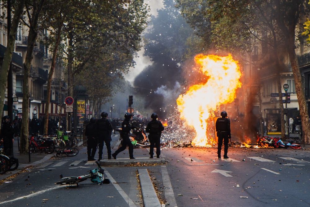 A group of police officers facing rioters and looters in Paris on October 17 (AFP/Getty)