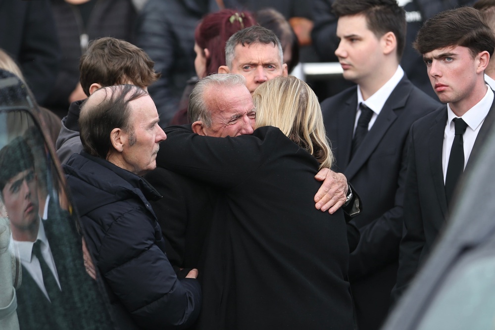 Hundreds gathered for the funeral mass at Sacred Heart Church on Monday, while thousands more watched the service online. (PA)