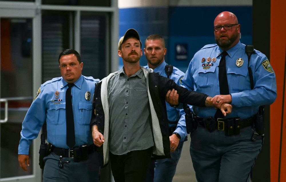 President Donald Trump has been interrupted by several demonstrators during his rally in Kansas, calling them idiots and accusing them of being paid protesters (AFP via Getty Images)