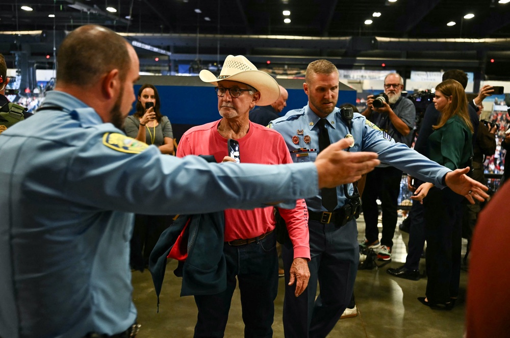 By the fourth interruption in his speech, Trump accused the protesters of being young people who get paid $250 to cause a disturbance and then 'ruin their whole lives' (AFP via Getty Images)