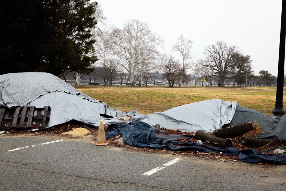 Trump shared an image of tarps in a parking lot on the 36-hole course (@RealDonaldTrump, Truth Social)