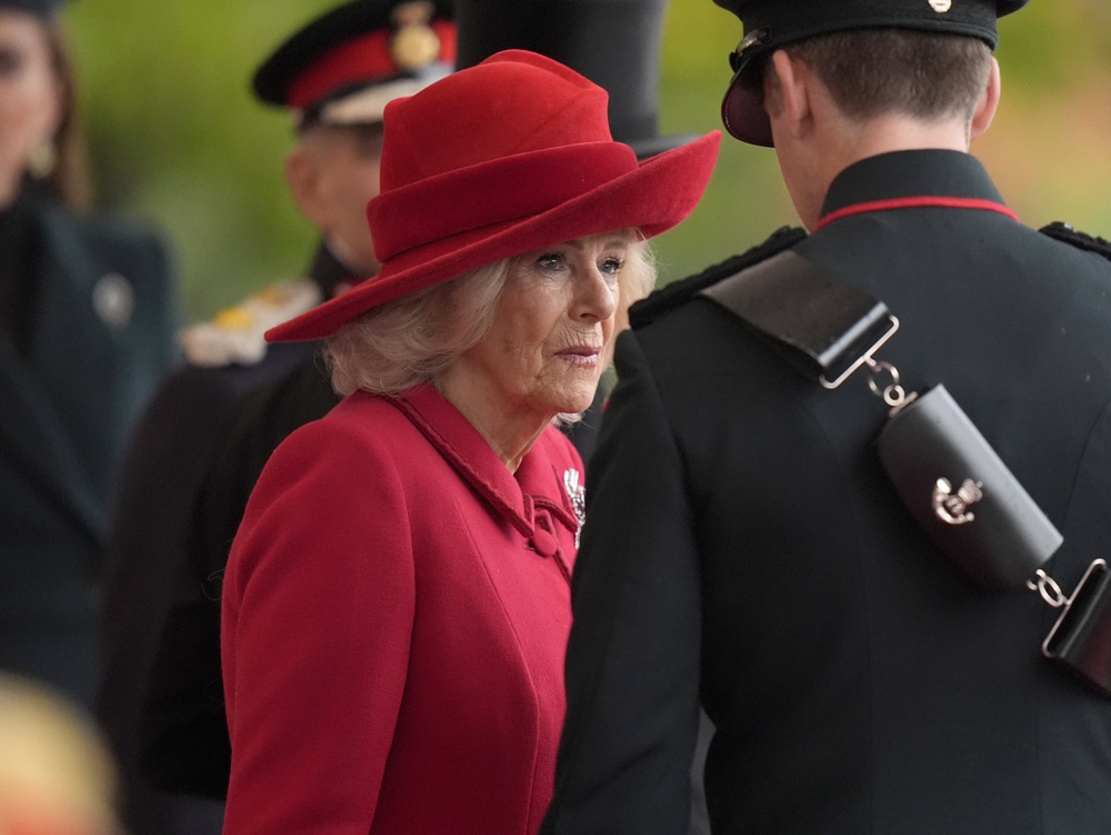 Camilla was wearing a red wool crepe dress and coat by Fiona Clare (Andrew Matthews/PA) (PA Wire)