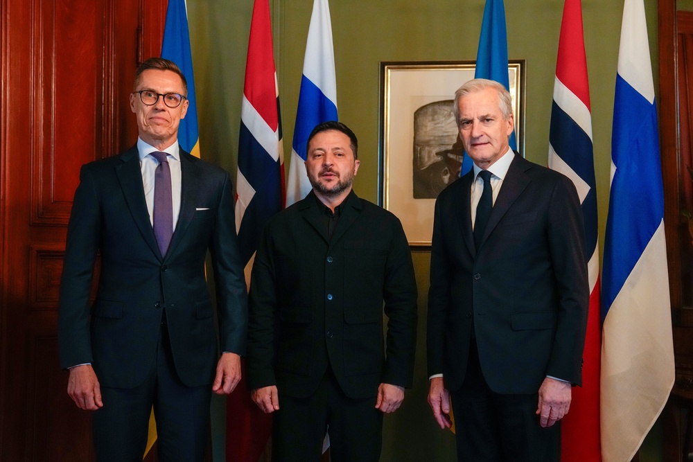 Volodymyr Zelenskyy, center, poses with Norwegian Prime Minister Jonas Gahr Støre and Finnish President Alexander Stubb, left, in Oslo (AP)