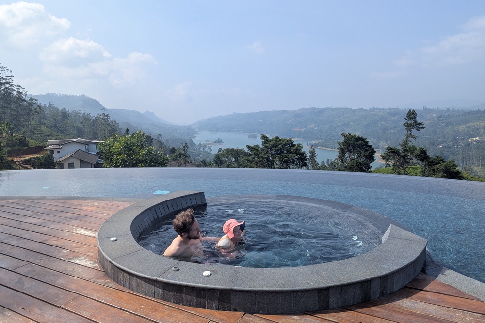Emilee’s partner and daughter in the infinity hot tub (Emilee Tombs/The Independent)