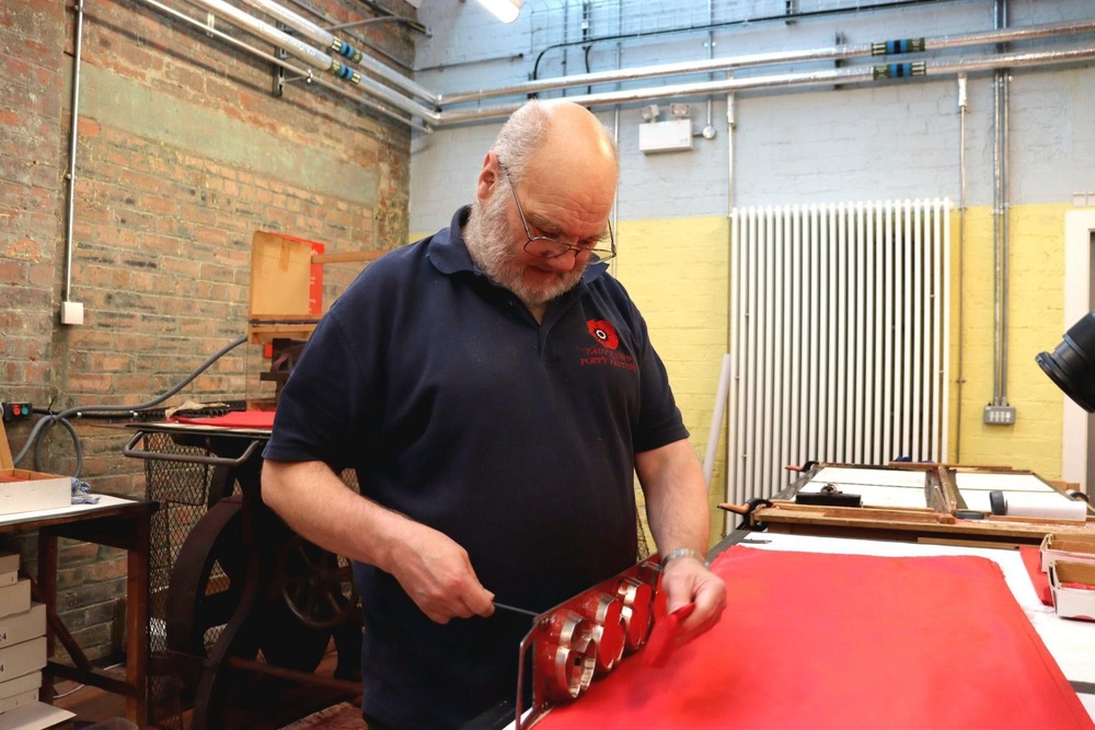 Jock Sloan makes poppies at Lady Haig’s Poppy Factory in Edinburgh (PA) (PA Wire)