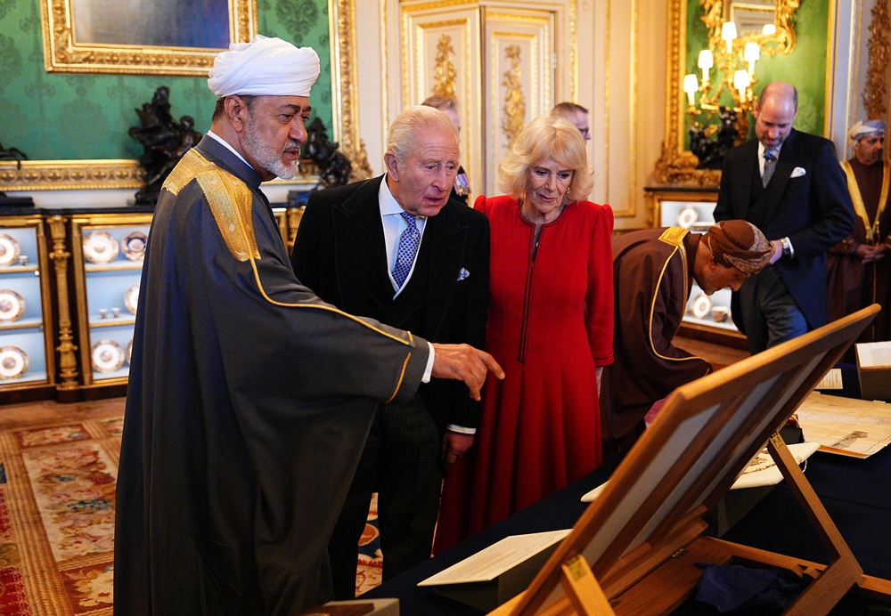 The Sultan of Oman, with the King and Queen viewing a display of items from the Royal Collection in the Green Drawing Room at Windsor Castle (Aaron Chown/PA) (PA Wire)