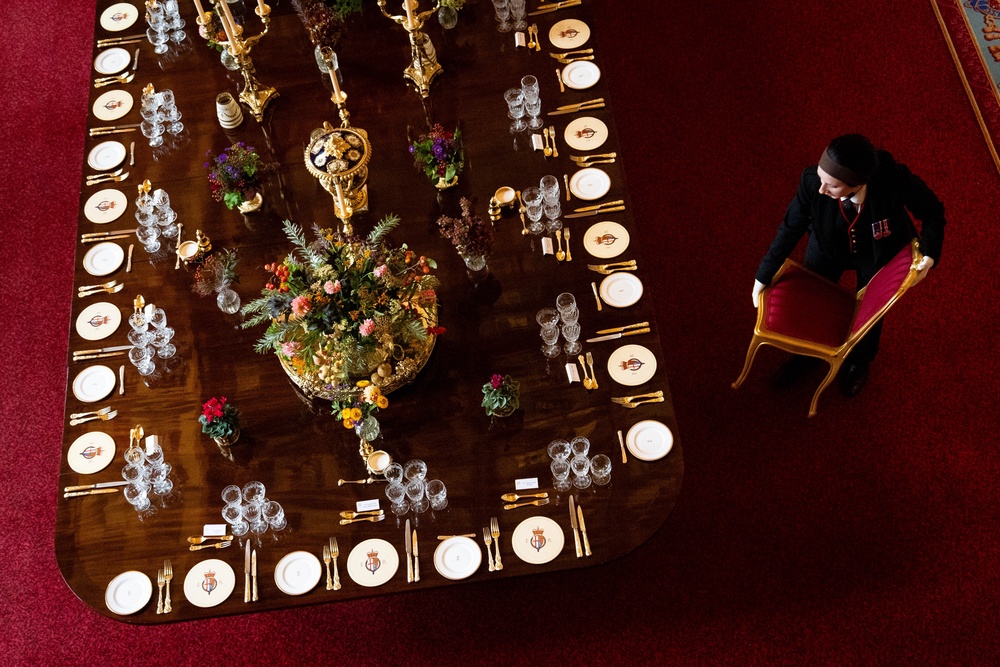 A chair is moved into position at the banquet table (Aaron Chown/PA) (PA Wire)