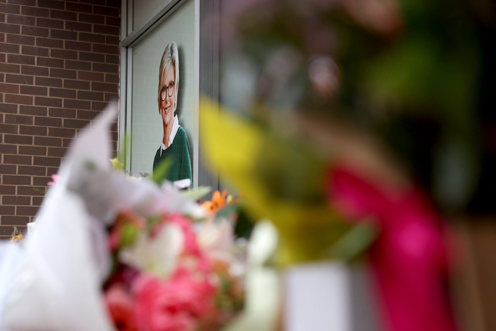 Floral tributes are placed outside the offices of Australian lawmaker Helen Haines who was critically wounded in a 'targetted' attack, in Wangaratta (AFP/Getty)