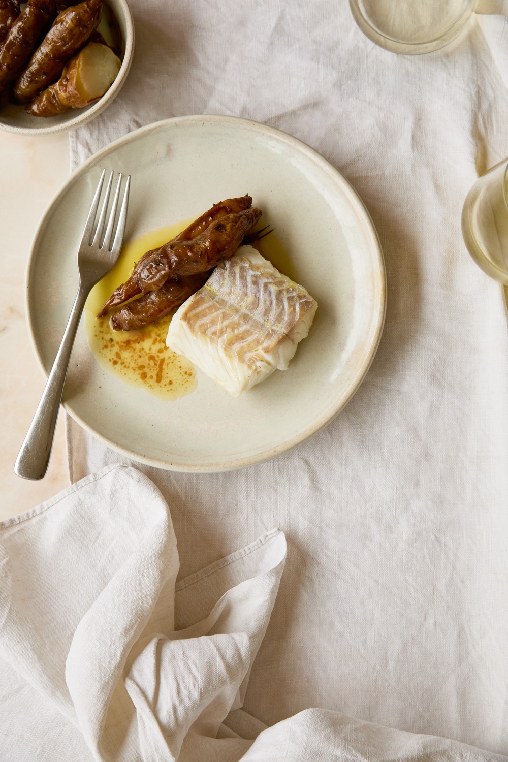 Mild, flaky hake gets a rich autumn upgrade with buttery artichokes and a savoury miso glaze (Helen Cathcart)