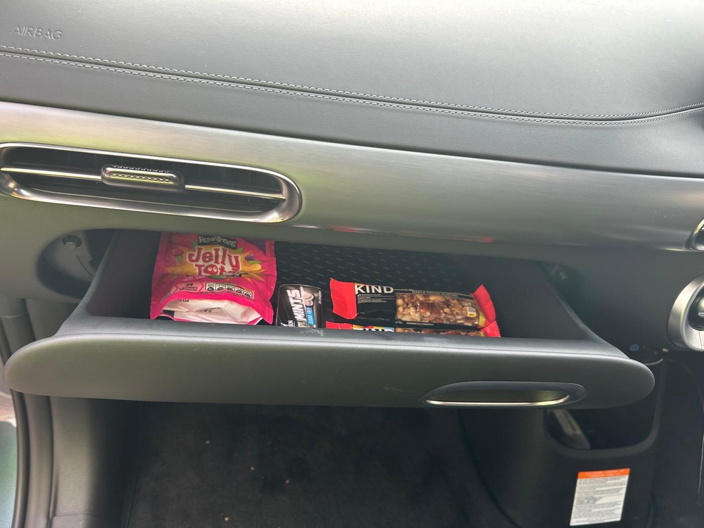 A slide-out drawer is a welcome difference from a drop-down glovebox (Gary Chatfield)