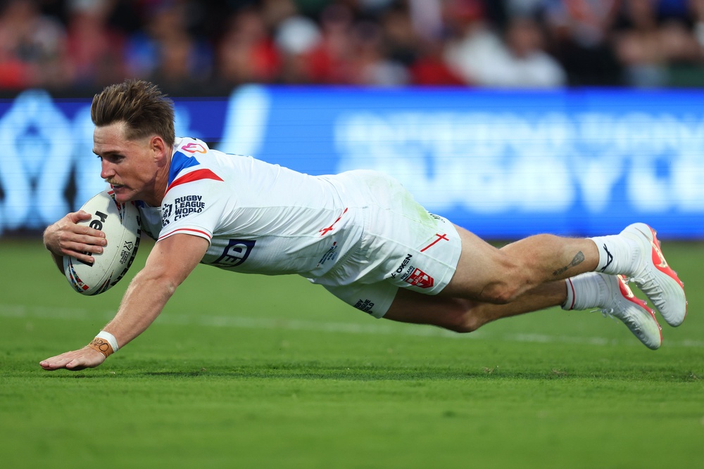 AJ Brimson scored for England against Tonga despite eventually losing 30-12 (Getty)