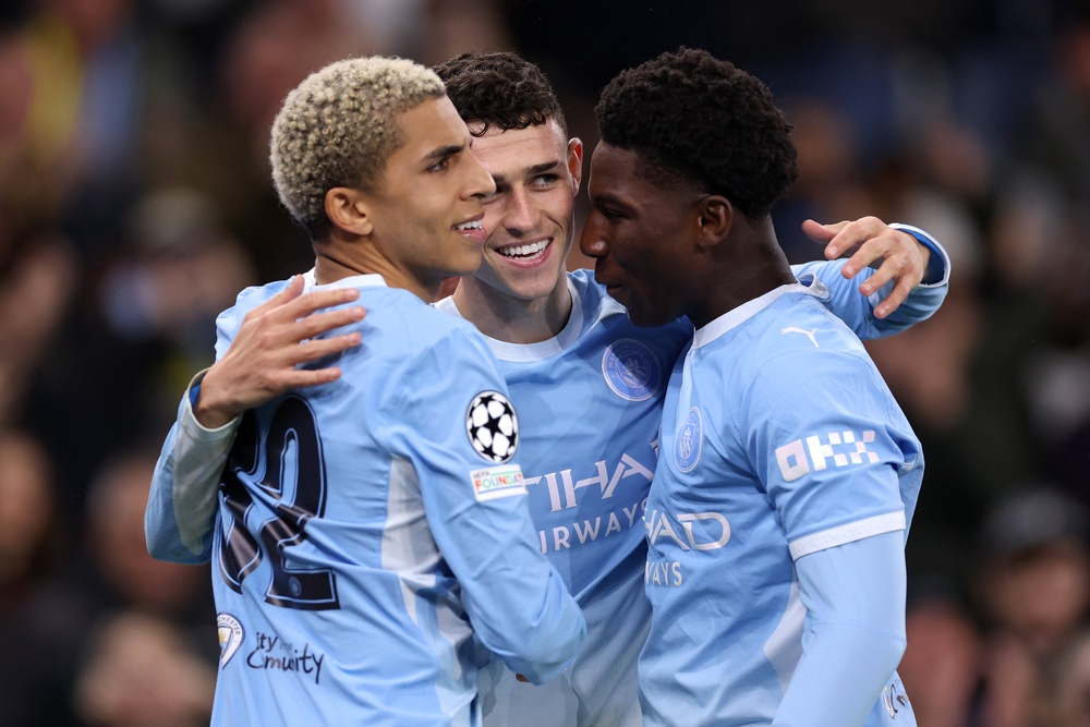 Phil Foden celebrates with Rico Lewis and Ryan McAidoo (Getty)