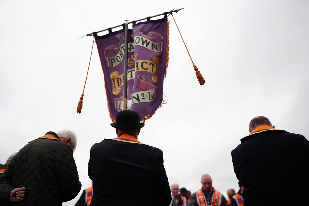 Orangemen make their way from Drumcree Church where police formed a barricade to prevent them entering the Garvaghy Road (Brian Lawless/PA) (PA Wire)