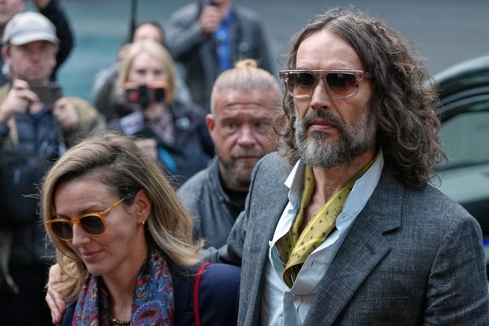 Comedian and actor Russell Brand, accompanied by his wife Laura Brand, arrives at Southwark Crown Court in London (Copyright 2026 The Associated Press. All rights reserved)