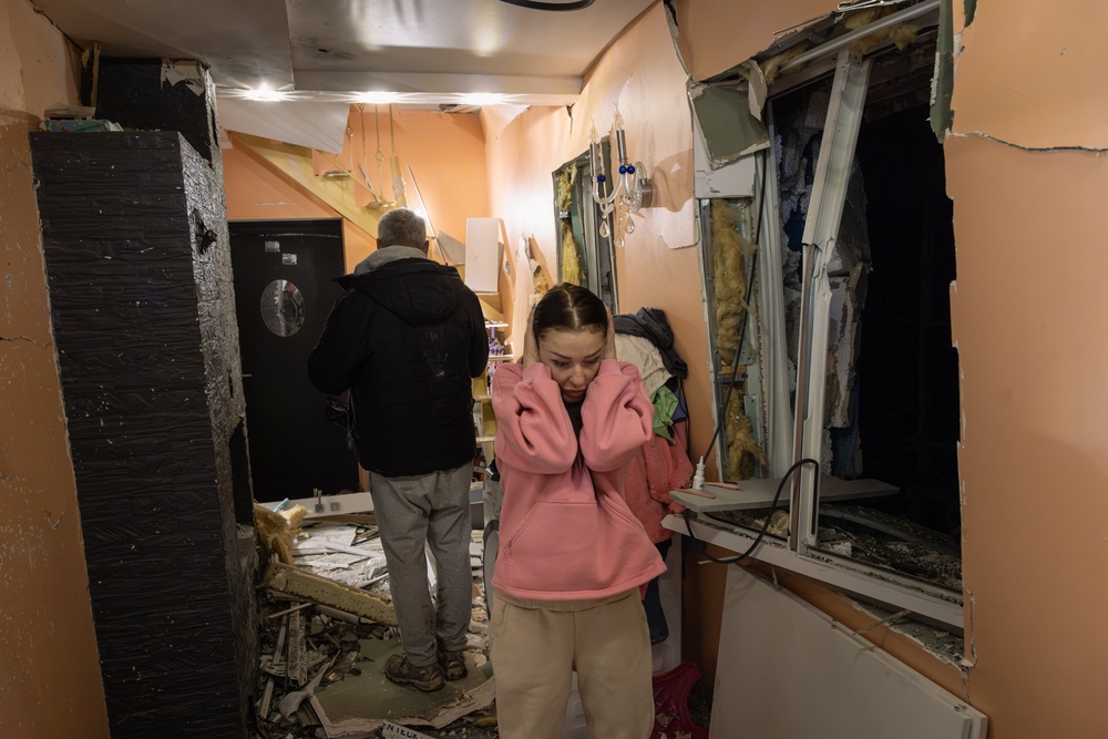 Natalya reacts as she looks at the damage inside her house following an aerial attack on October 22, 2026 in Kyiv (Getty)