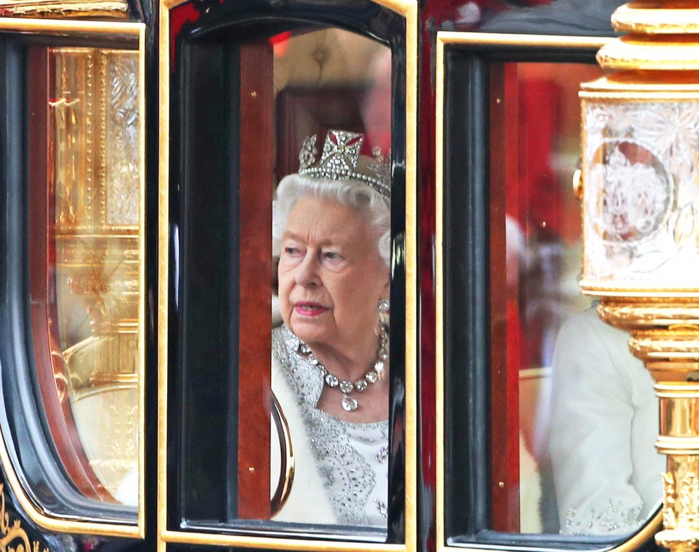 Queen Elizabeth II, wearing the Diamond Diadem, returning to Buckingham Palace after the state opening of Parliament in 2019 (Yui Mok/PA) (PA Archive)