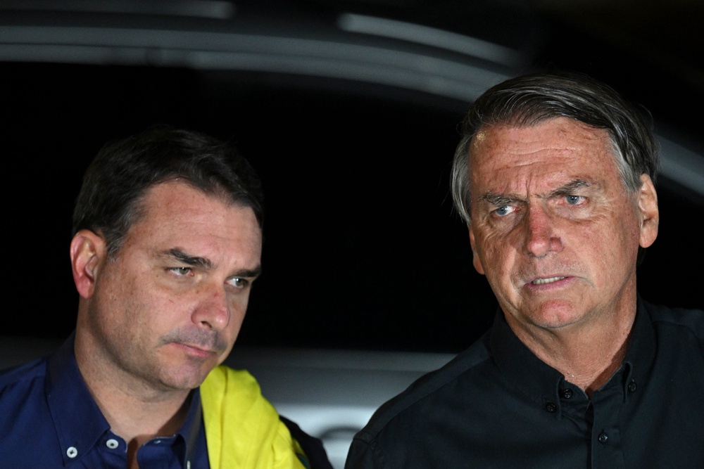 Former president Jair Bolsonaro and his son, Flavio (AFP/Getty)