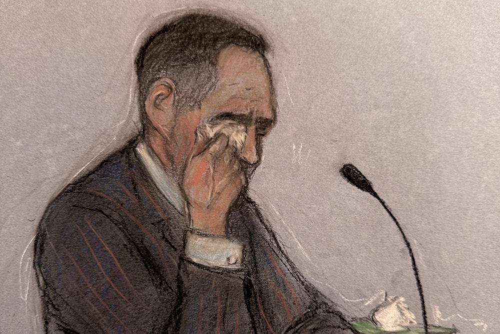 Court artist sketch showing Tommy Robinson breaking down in tears while giving evidence at Southwark Crown Court (PA)