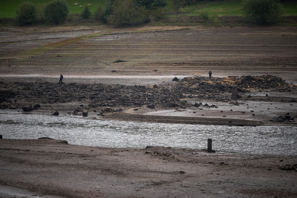 Local authorities cautioned that the newly exposed reservoir bed presents dangers to those who may attempt to walk on it (Getty)