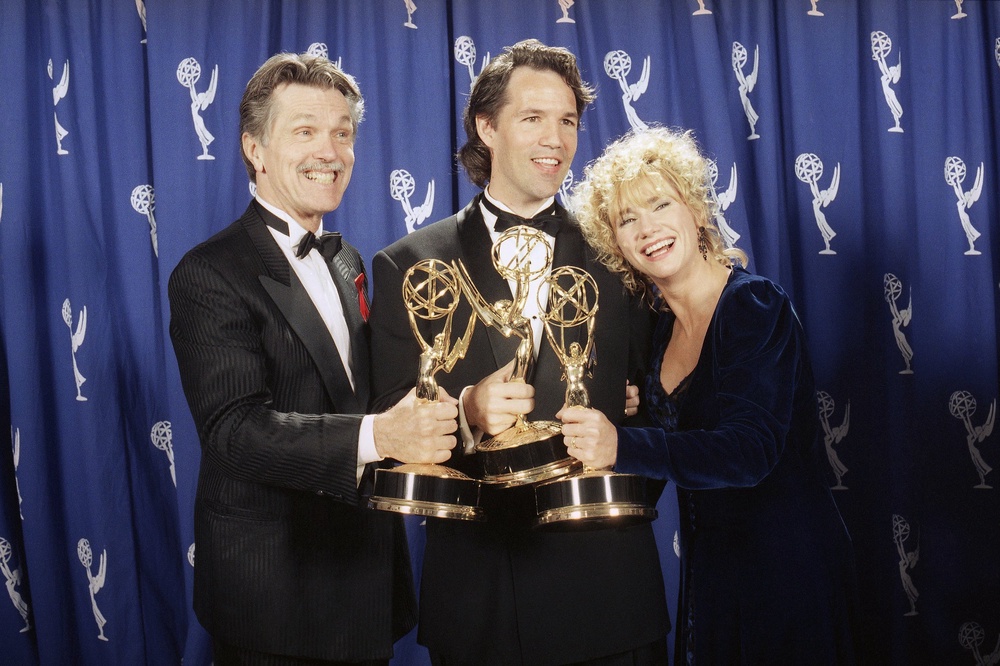 Picket Fences creator David E. Kelley poses with actors Tom Skerritt and Kathy Baker after the show won best drama series during the 45th annual Emmy Awards (AP)