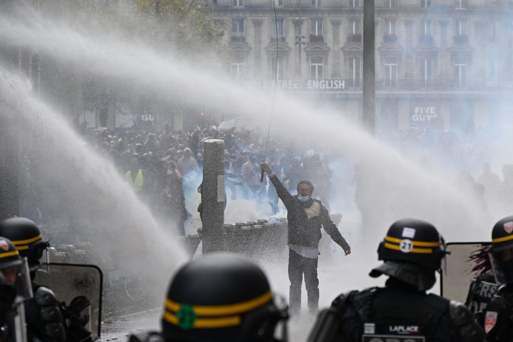 Image from: France protests latest: 135 arrested and tear gas fired at demonstrators as unrest erupts