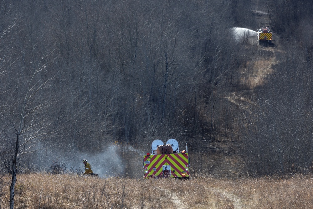Firefighters working close to Canadian Forces Base Wainwright in Wainwright, Alberta, Canada, on October 18, 2026 (AFP/Getty)
