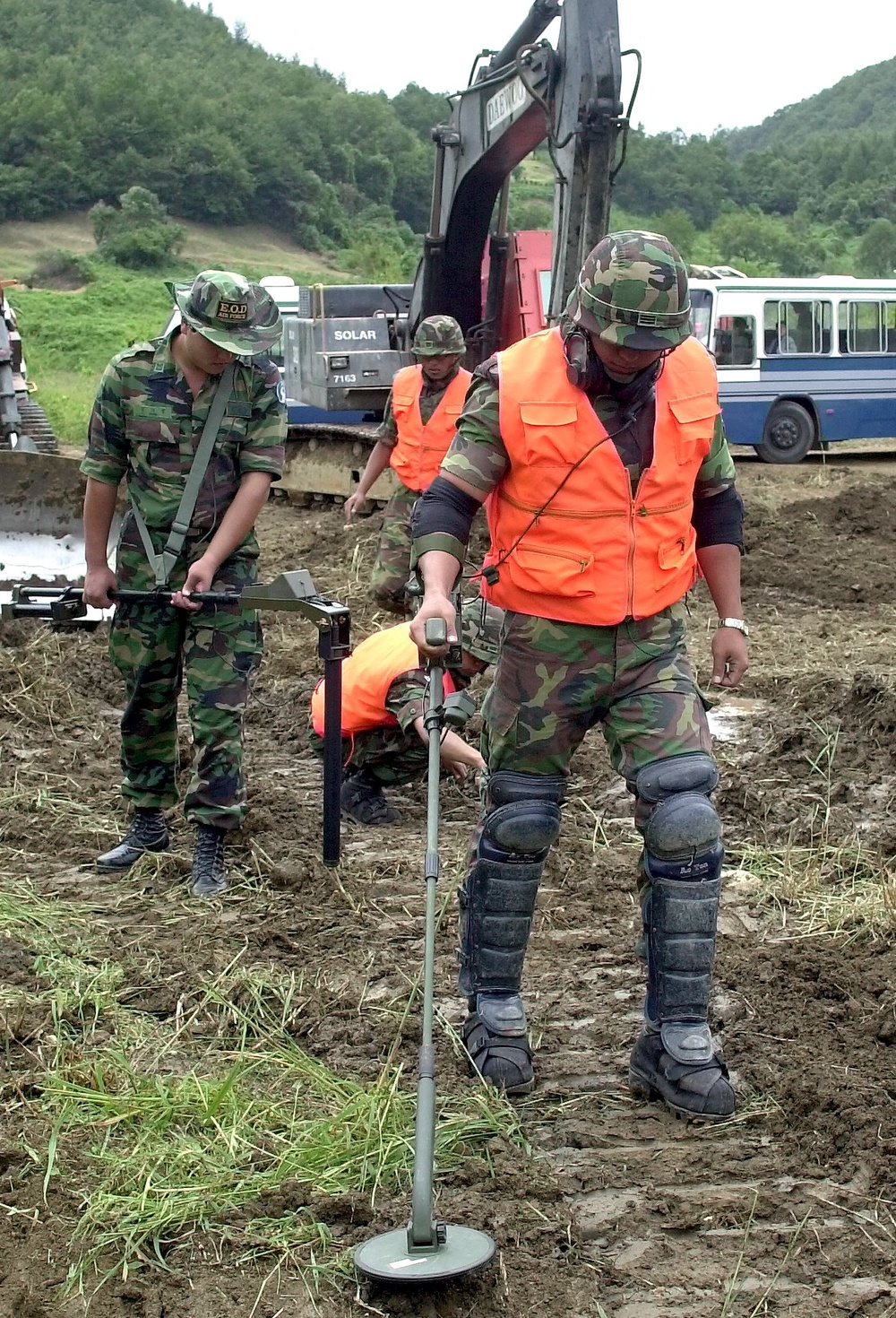South Korean soldiers demonstrate the search and removal of landmines as they rebuild a 20km stretch of railway line across the Demilitarized Zone on 7 September 2000 (AFP/Getty)