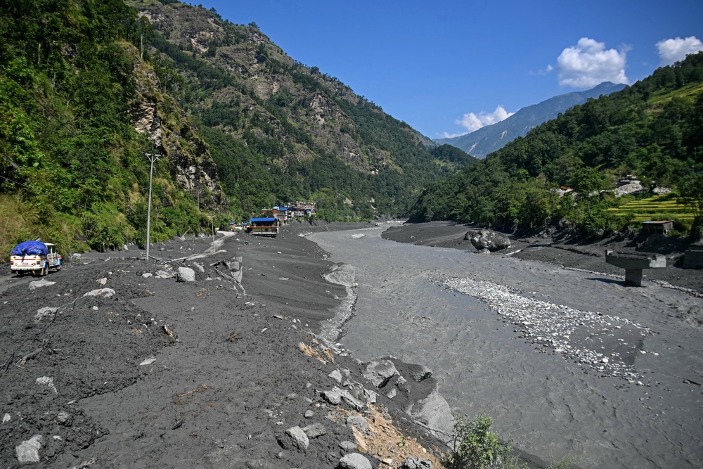 Damaged houses lie partially submerged in sludge along the banks of the Budhi Gandaki river at Soti Bazar in Nepal's Gorkha district (AFP/Getty)