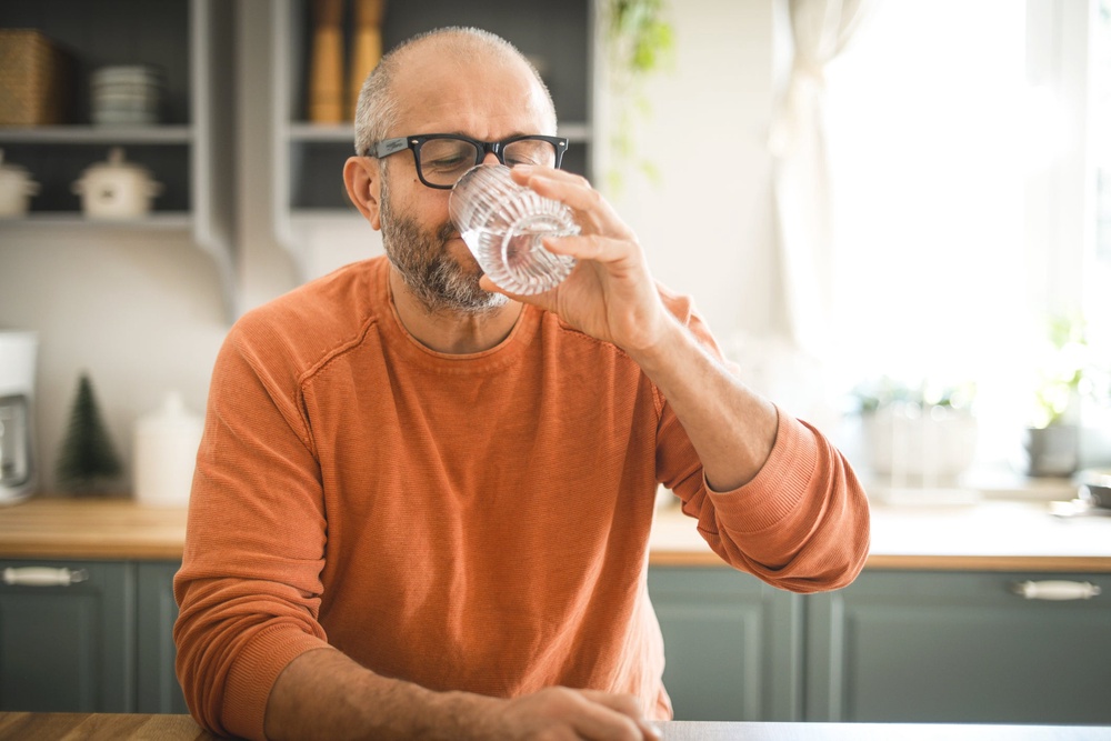 Gargling salt water can help soothe a sore throat and loosen mucus (Getty/iStock)