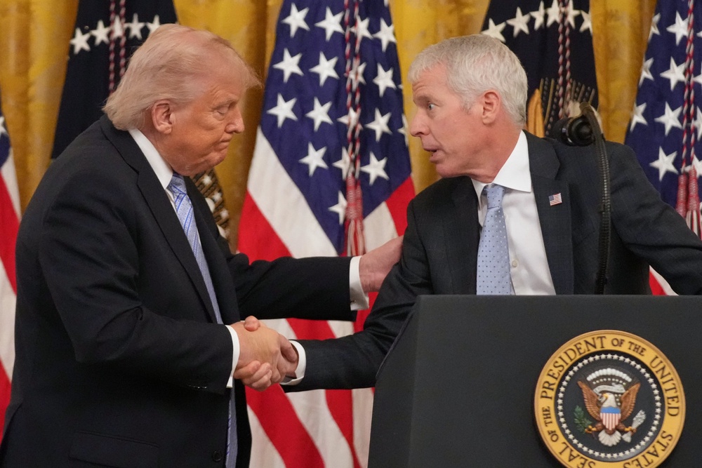 President Donald Trump shakes hands with Energy Secretary Chris Wright on May 4, 2026 at the White House in Washington (AP Photo/Mark Schiefelbein, File)