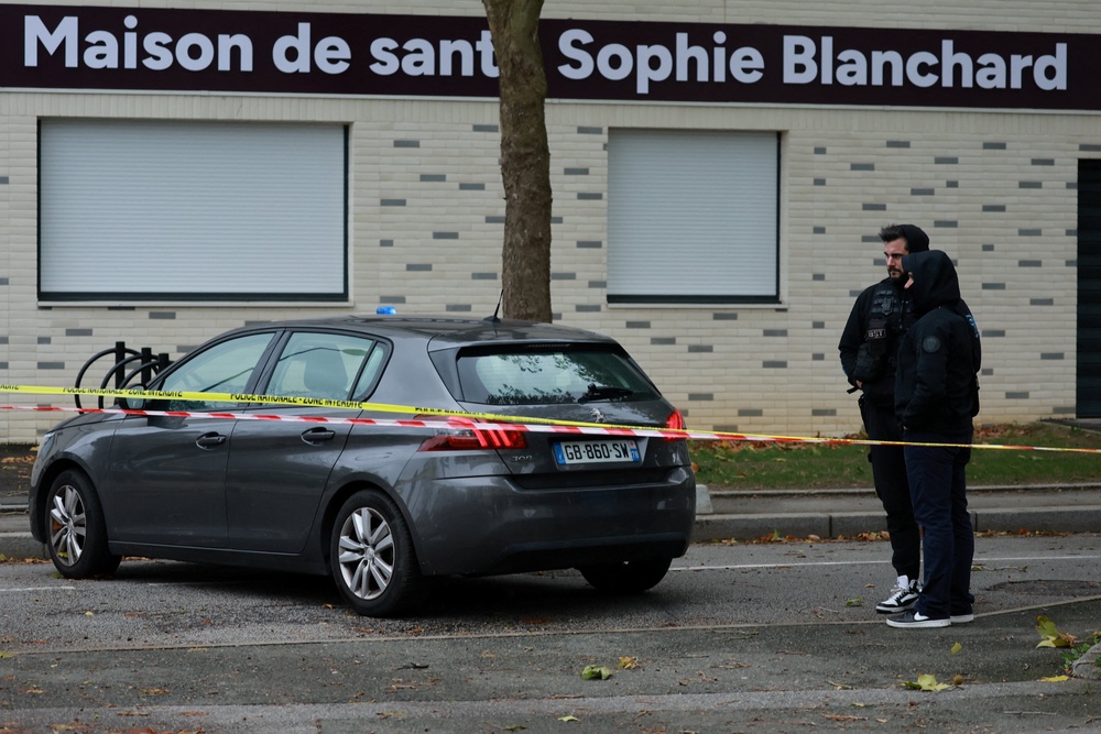 French police work at the scene after a drive-by shooting that killed one person and injured several others in Trappes, in the Yvelines area (Reuters)