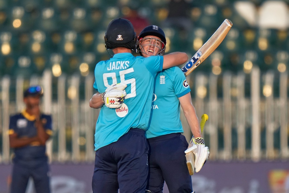 Harry Brook, right, hugs Will Jacks after bringing up his double hundred (Anjum Naveed/AP) (AP)
