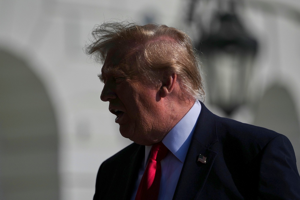 Trump speaks with reporters before boarding Marine One on the South Lawn of the White House, Friday, Oct. 23, 2026, in Washington (AP)