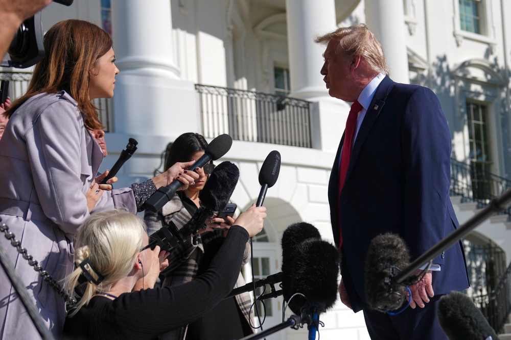 Donald Trump speaking to reporters outside the White House (Julia Demaree Nikhinson/PA) (AP)