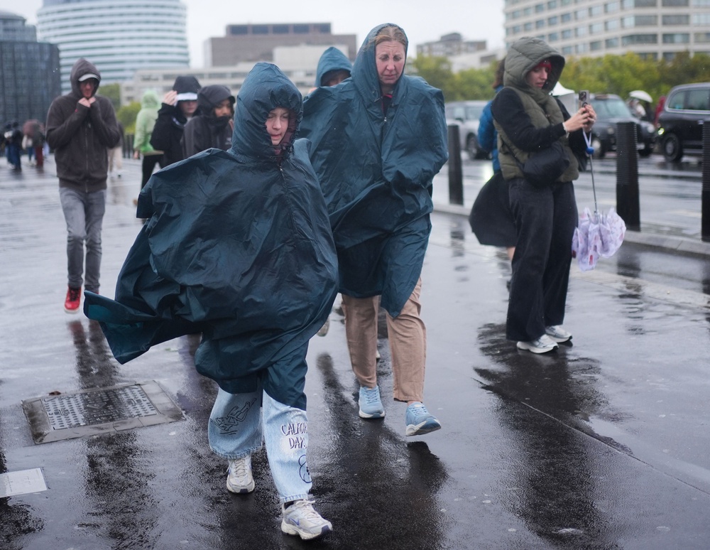 People walking in the rain on Westminster Bridge in London on Friday (Yui Mok/PA) (PA Wire)