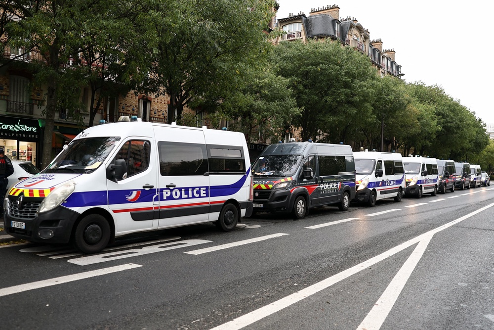 Police vehicles are parked near La Pitie-Salpetriere (AFP/Getty)