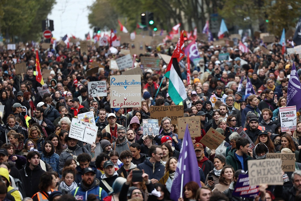 Protesters attend an authorised demonstration organised by labour unions in Paris (Reuters)
