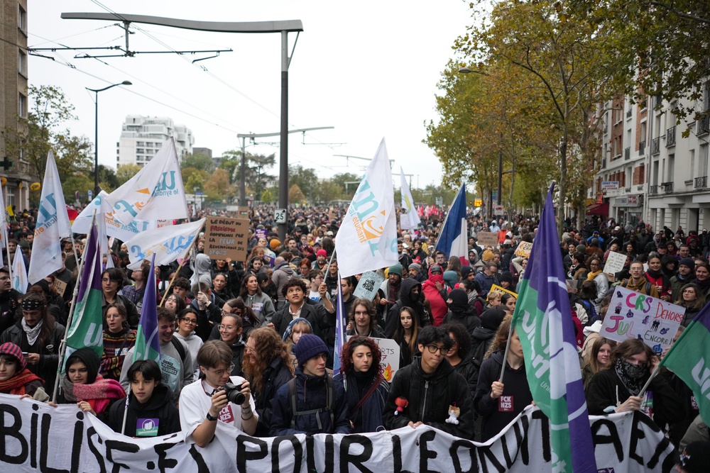 Protesters and students chant slogans during a demonstration against rising living costs in Paris (AP)