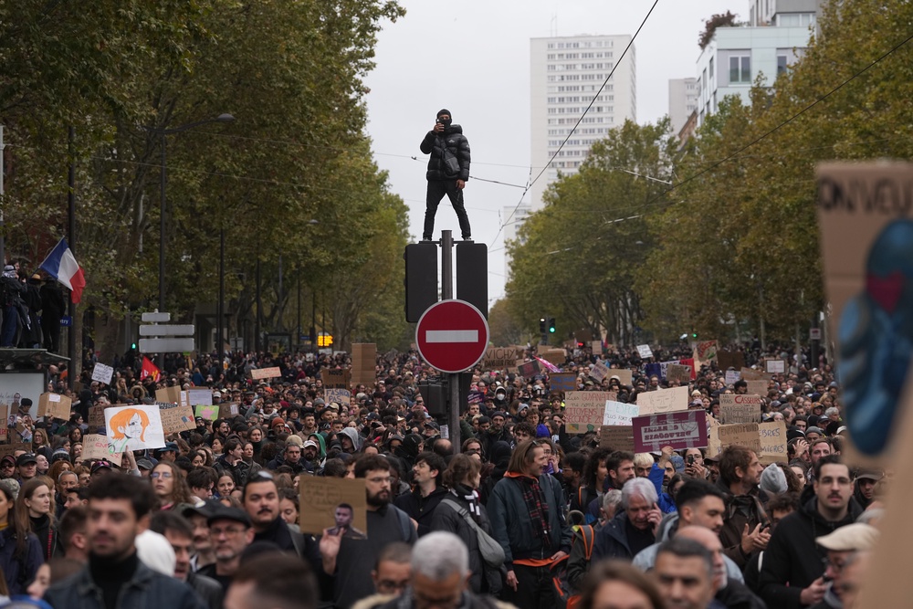 Protesters march during a demonstration against rising living costs in Paris (AP)
