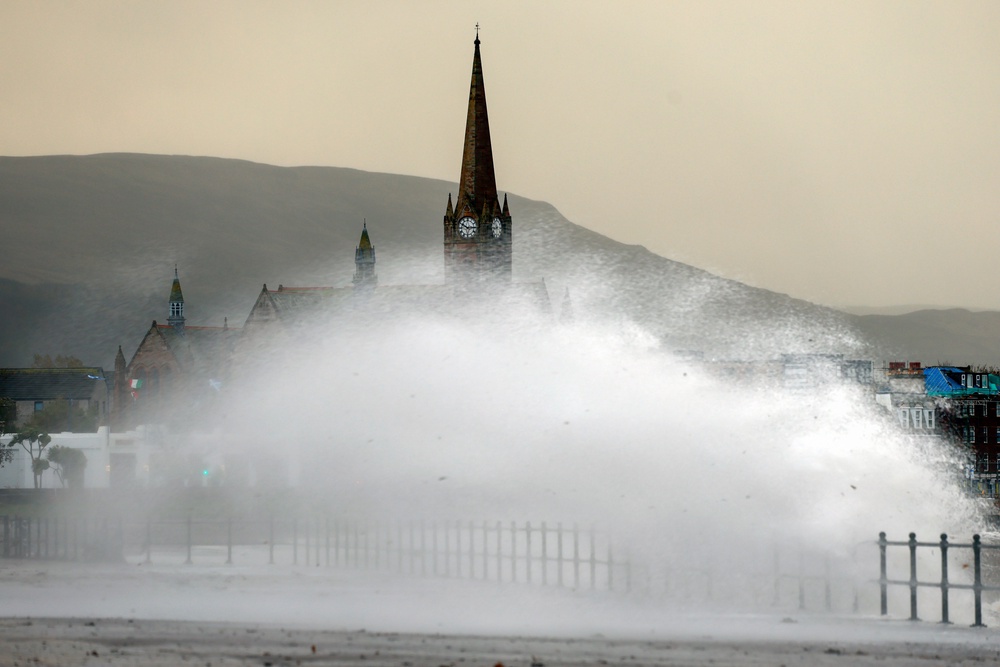Waves crash over the promenade in Largs (Getty)