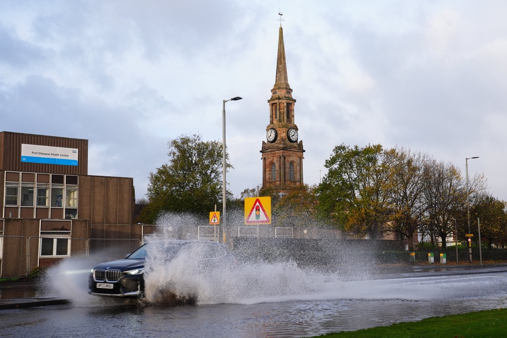 Flood water on the A8 in Port Glasgow (Jane Barlow/PA) (PA Wire)
