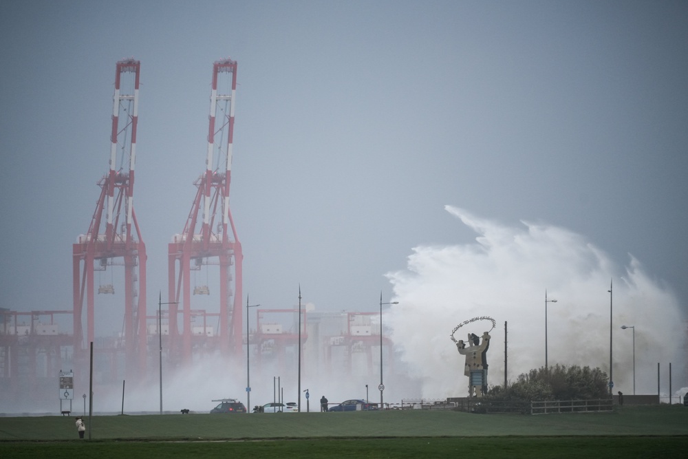 Waves created by the high winds of Storm Boelo hit the sea wall at New Brighton (Getty)