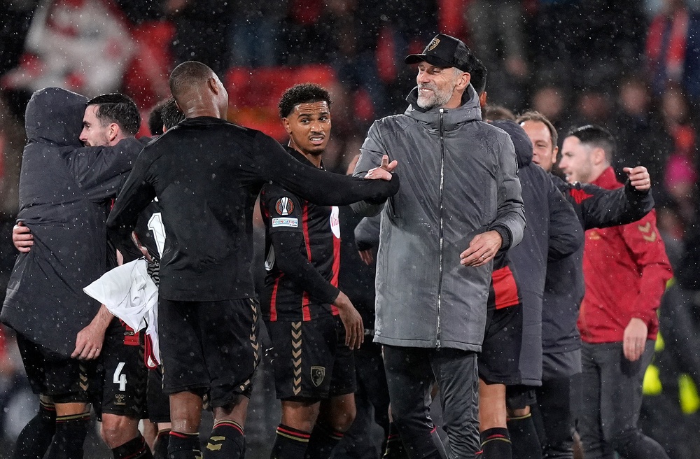 Marco Rose (centre right) and Bournemouth celebrated an iconic win over AC Milan (PA)