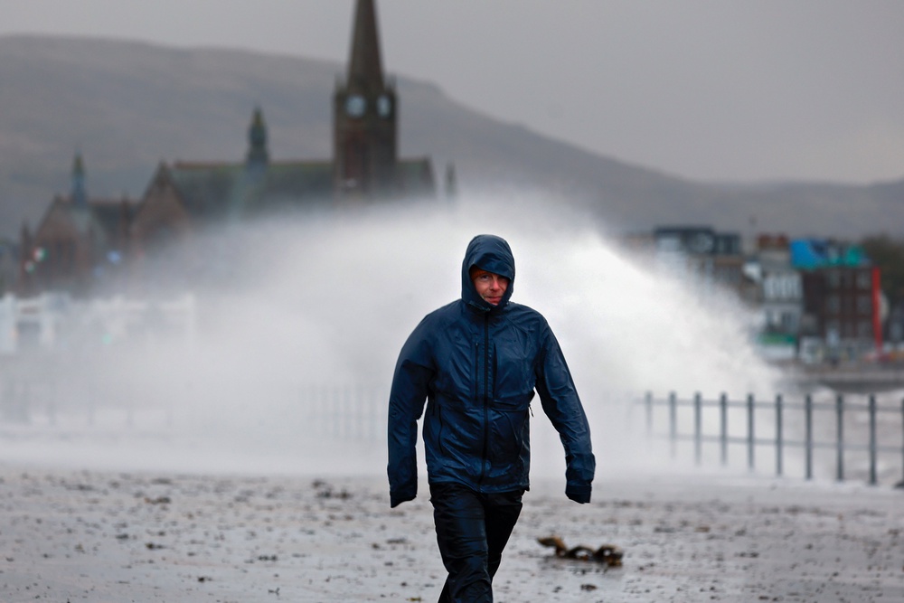 Waves crash over the promenade in Largs (Getty)