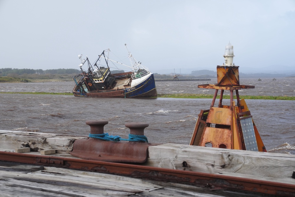 A fishing boat stranded at Irvine Harbour in Ayrshire after coming loose from its moorings when Storm Boelo passed through the area (Jane Barlow/PA) (PA Wire)