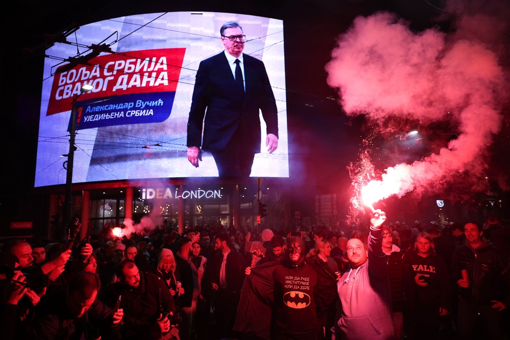 Aleksandar Vucic, leader of the right-wing Serbian Progressive Party (SNS) , seen on the top display, conceded defeat on Sunday (AP)