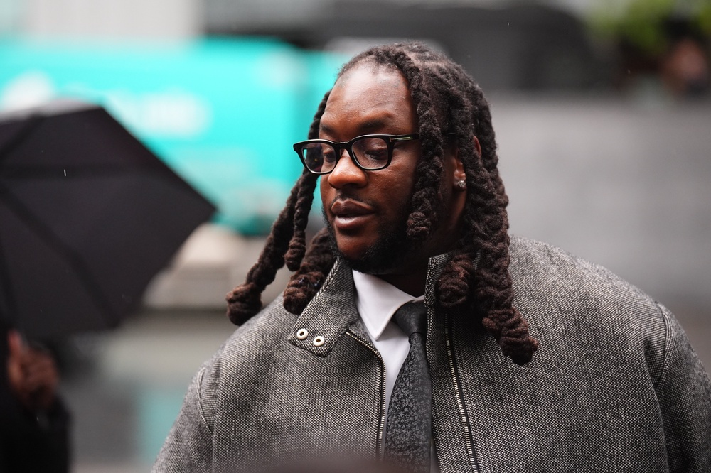 Omololu Akinlolu arriving at Southwark Crown Court (PA)